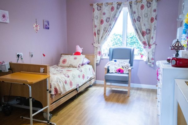 Bright bedroom with pink accents and cheerful interior design