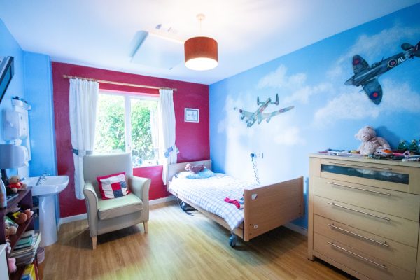 Colorful bedroom with pink and blue decor and playful design