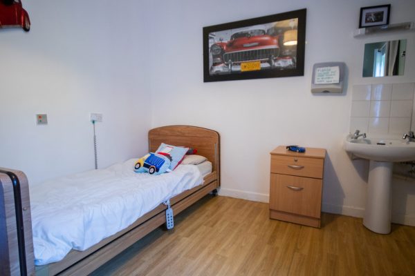 bedroom with sink and drawers